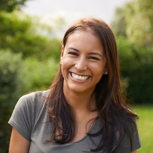 WOman smiling outdoors after fluoride treatment