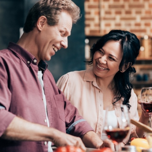 Man and woman cooking in their kitchen together