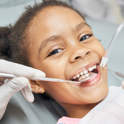 Little girl smiling during a dental checkup