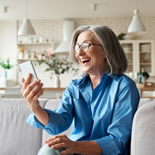 Older woman on a video cell phone call