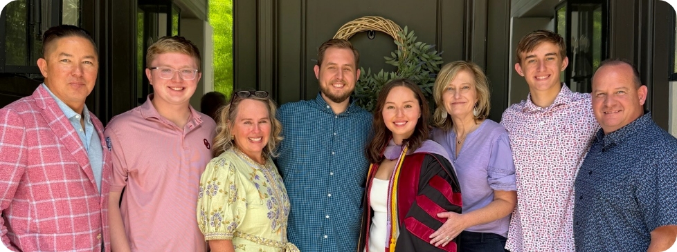 Doctor Terrell and family in graduation Gown