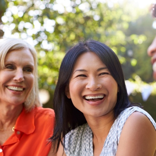 Group of women laughing together outdoors