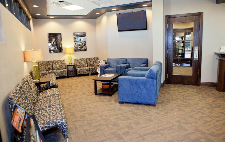 Comfortable couches and armchairs in waiting room of Bobby J Carmen D D S