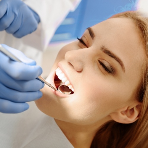 Young woman smiling during her dental checkup