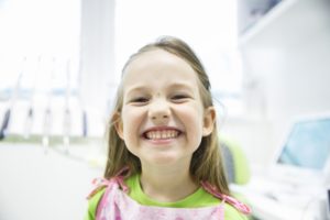 Young girl smiling after sedation dentistry in Norman. 