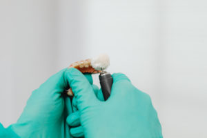 Dental lab repairing broken denture