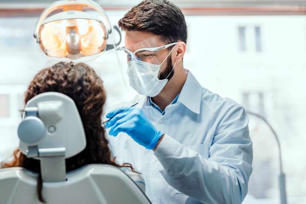 patient getting dental checkup and cleaning