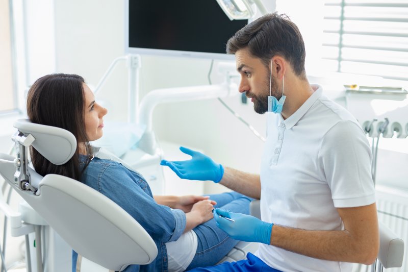 A patient talking with her dentist about teeth whitening
